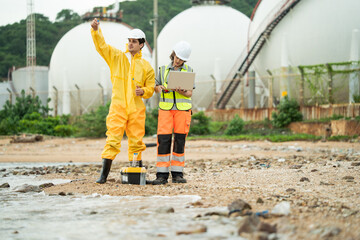 Environment scientist with team analysing waste water test results and collecting sample for research or inspection of the ecosystem and study of nature from an industrial factory into the sea