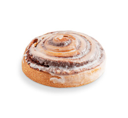 Side view of one delicious homemade sweet cinnamon roll bun or swirl glazed or decorated with sugar icing isolated on white background served for breakfast as freshly baked pastry traditional dessert