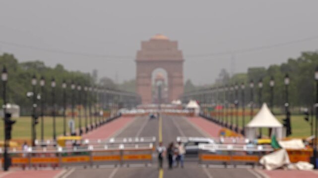 Bokeh view of Kartavya Path in front of India Gate during the heatwave season in New Delhi, India. Blurred background footage.