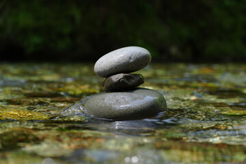Zen Stone Stack in Flowing River Water a Peaceful Nature Scene of Relaxation and Balance