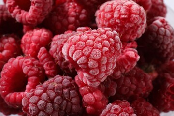 Many ripe frozen raspberries as background, closeup