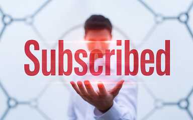 Man holding red subscribed text with glowing effect