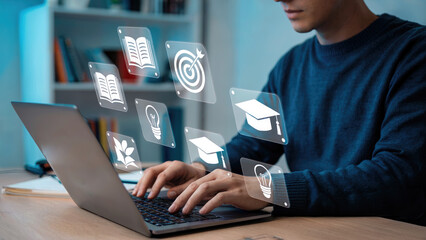 Man engaged in online learning with laptop and educational icons, concept of knowledge