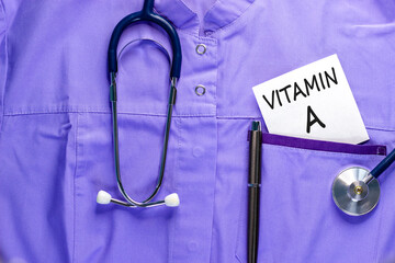 Vitamin A symbol. Concept words Vitamin A on beautiful white card. Stethoscope and pen. Beautiful...