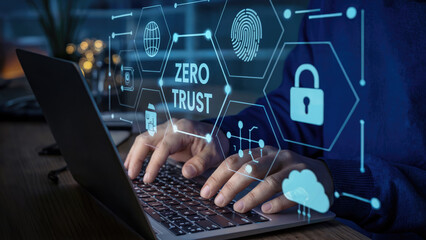 Cybersecurity expert working on Zero Trust security with modern laptop and digital interface