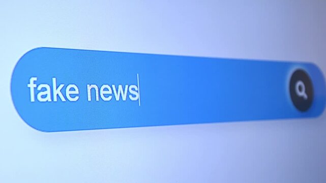 Typing "Fake news" in search bar, misinformation and media disinformation concept footage.