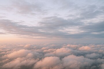 Aerial View of Fluffy Clouds at Sunset, Golden Hour Cloudscape, Atmospheric Sky Above the Clouds
