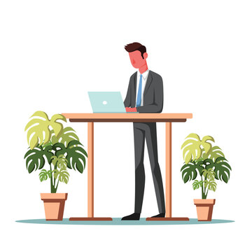 Business Professional Standing At Wooden Desk With Monstera Plants And Laptop In Modern Office Setting