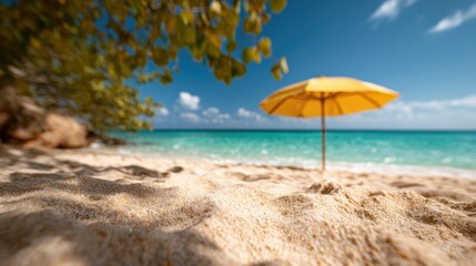 A stunning view of a sunny beach featuring a vibrant yellow umbrella, soft golden sand, and crystal-clear turquoise waters under a blue sky, perfect for relaxation.
