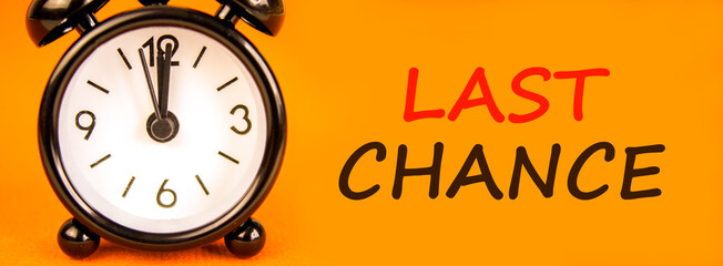 Last chance symbol. Concept word Last chance on beautiful orange paper. Beautiful black alarm...