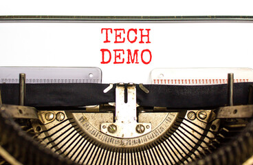 Tech demo symbol. Concept word Tech demo typed on beautiful old retro typewriter. Beautiful white...