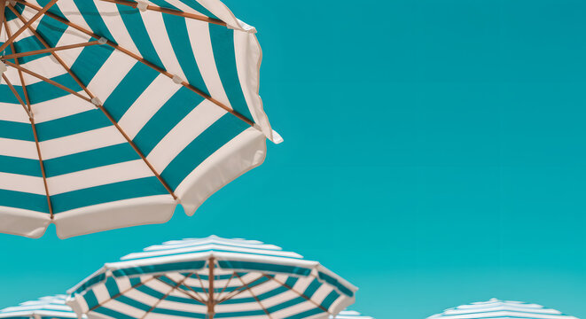Teal and White Striped Beach Umbrellas Under a Vibrant Summer Sky: Relaxing Vacation Scene. - Powered by Adobe