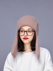 Girl wearing a cozy hat indoors
