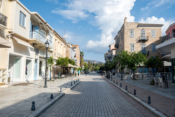 Pedestrian street with historic buildings and cafes in Nafplio Greece under bright afternoon sunlight and blue sky