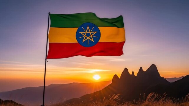 Ethiopian Flag Waving at Sunset - The Ethiopian flag proudly waves atop a mountain peak as the sun sets, casting a warm golden light across the landscape.