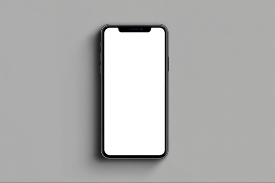 A white phone is sitting on a grey surface. PNG transparency.