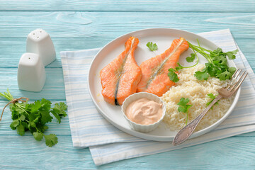 baked salmon steaks with rice, cilantro and sauce