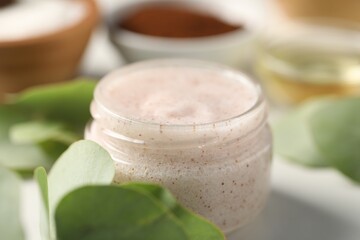 Natural body scrub on white table, closeup
