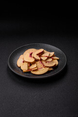 Dried sublimated slices of peach or apricot as an ingredient for sweet desserts. Dried peach