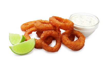 Fried squid rings, lime and sauce isolated on white