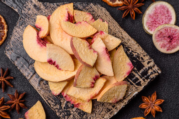 Dried sublimated slices of peach or apricot as an ingredient for sweet desserts. Dried peach