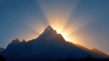 Obraz premium Majestic mountain peak illuminated by stunning sunrise, casting rays of light across landscape, creating serene and breathtaking atmosphere