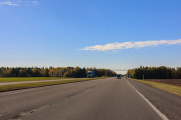 Naklejka premium Autumn landscape, road and highway, asphalt and roadside.