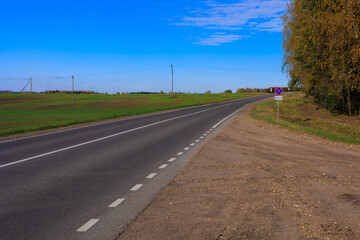 Fototapeta premium Autumn landscape, road and highway, asphalt and roadside.