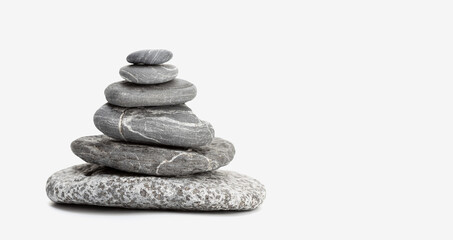 Balanced Stones isolated on white background with copy space. Balancing Pebbles. Life balance and harmony concept