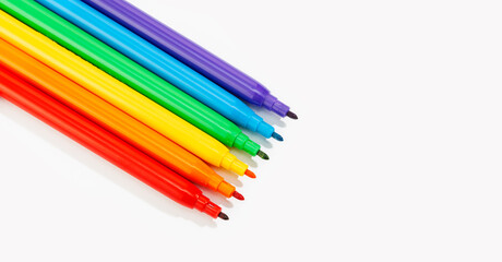 Markers of rainbow colors isolated on white background