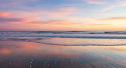 Fototapeta premium Gentle sunset over beach, soft colors reflected in water
