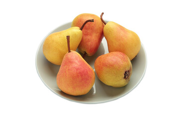 Fresh pear fruit on grey plate isolated on white background. Healthy fruit