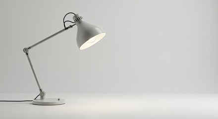 Minimalist Gray Desk Lamp Illuminating White Surface, Studio Lighting, Clean Aesthetic