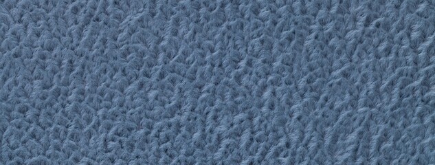 Texture of dark blue background from soft fluffy textile material macro. Structure of denim plush...