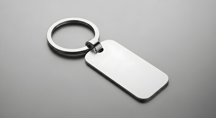 Fototapeta premium Blank Silver Metal Keychain Mockup on Gray Background
