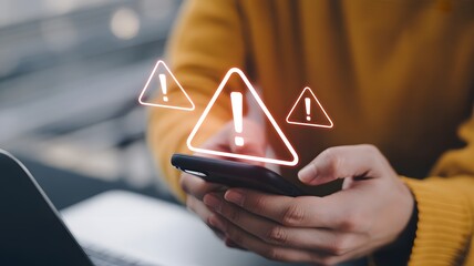 Digital Warning: A person in yellow sweater closely looks at a smart phone displaying an array of illuminated alert symbols. conveying a sense of technological anxiety or potential online threat.