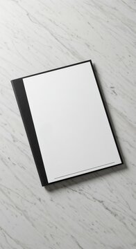 Top down view mockup blank white page on black leather pad for menu or specials for restaurant or coffee shop on white marble surface background