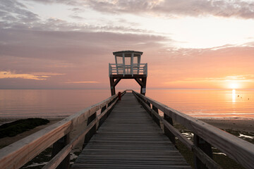 Luc-Sur-Mer, France - 08 07 2025: View of the wooden pier in front of the sea named Fisherman's...