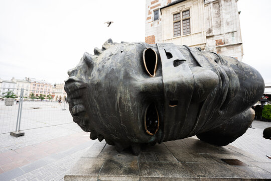 Large artistic Eros Bendato bronze sculpture in Krakow's historic square