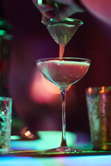 Bartender Preparing Cocktails at a Bar Counter	