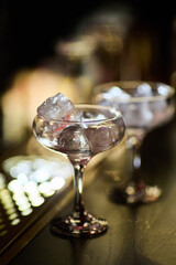 Empty Elegant Glasses With Ice Cubes	