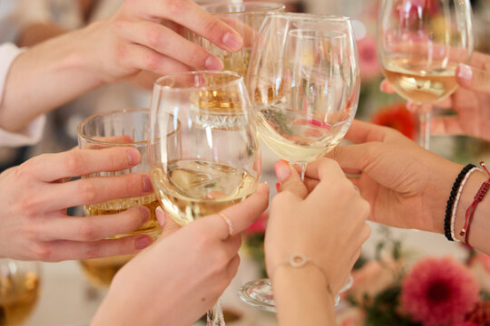 Hands Raising Glasses at Party Celebration