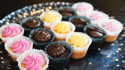 Beautiful chocolate and assorted cupcakes on an elegant plate, perfect for parties or family...