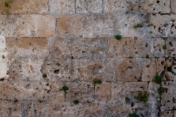 background in the form of a stone wall made of large sand blocks