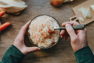 Preparing Sauerkraut with Fresh Cabbage in Kitchen