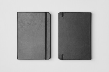 Notebook mockup showing front and back cover from overhead on a gray background