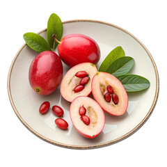 Ripe red carissa carandas berries with leaves on a plate isolated on transparent background