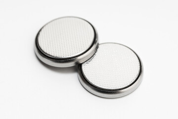 Button cell battery or coin cell isolated on white background