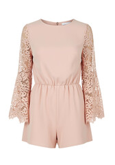 Obraz premium A peach colored romper with lace sleeves on a black background