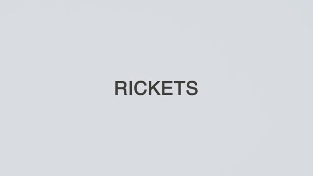 Rickets concept word stethoscope hand diagnosed on white background for bone health awareness, patient care, and medical evaluation of vitamin deficiency